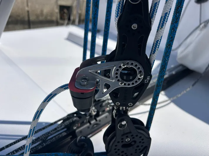  Yacht Photos Pics Close-up of rigging on a 2025 Beneteau First 30 sailboat, featuring pulleys and ropes.