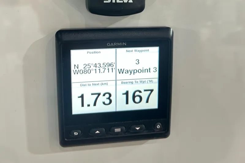 Yacht Photos Pics Garmin navigation display on 2025 Beneteau First 30, showing coordinates and waypoint details.