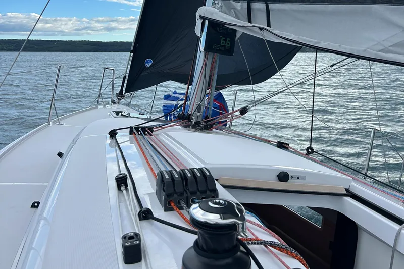  Yacht Photos Pics 2025 Beneteau First 30 sailboat on water, showcasing deck and rigging details.