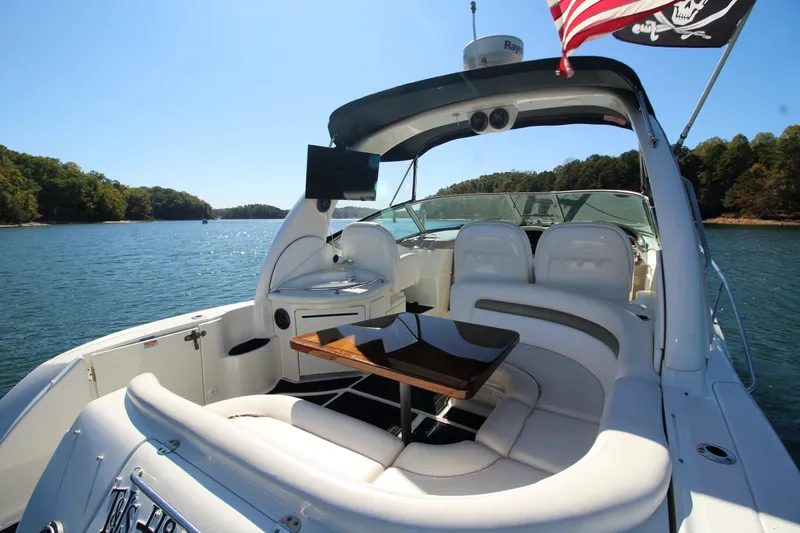  Yacht Photos Pics 2006 Sea Ray 340 Sundancer yacht with spacious seating on a serene lake.