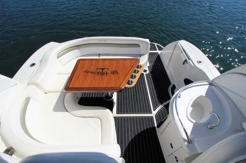  Yacht Photos Pics 2006 Sea Ray 340 Sundancer boat deck with seating and table on water.
