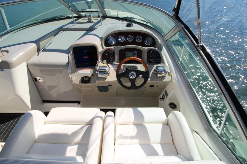  Yacht Photos Pics 2006 Sea Ray 340 Sundancer helm with white seating and modern controls.