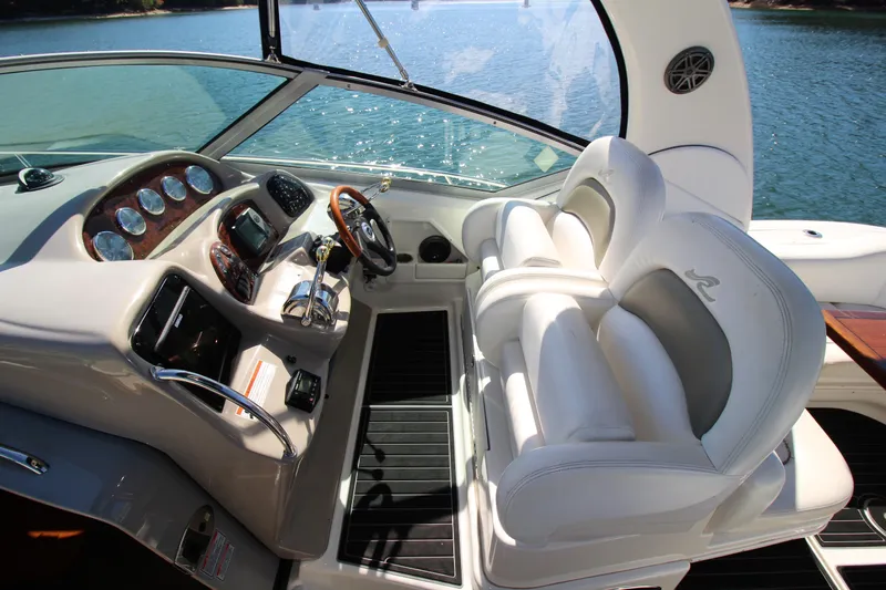  Yacht Photos Pics 2006 Sea Ray 340 Sundancer cockpit with luxurious seating and modern controls.