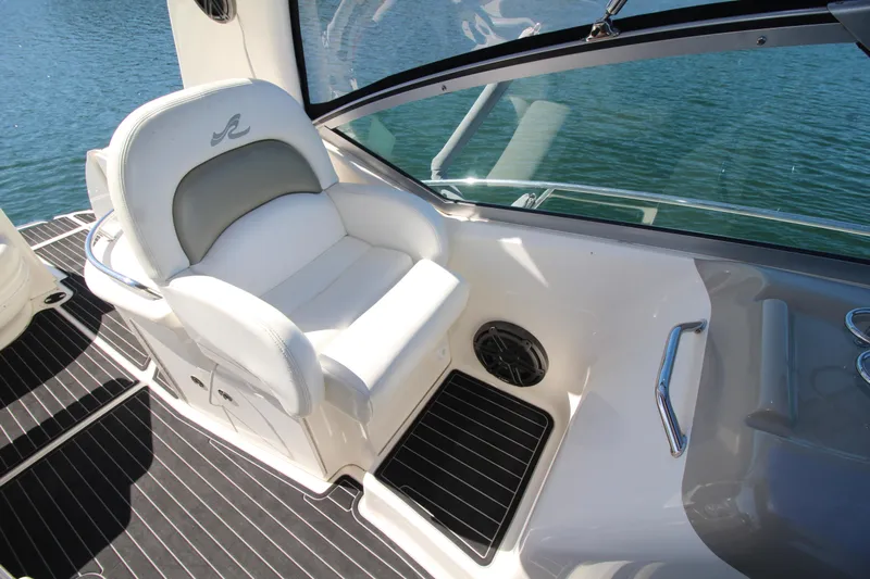  Yacht Photos Pics Captain's seat on 2006 Sea Ray 340 Sundancer, overlooking water.