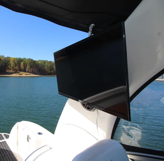  Yacht Photos Pics Flat-screen TV on 2006 Sea Ray 340 Sundancer yacht, overlooking serene lake view.