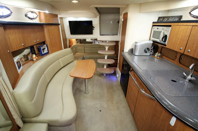  Yacht Photos Pics 2006 Sea Ray 340 Sundancer interior with kitchen, seating, and entertainment area.
