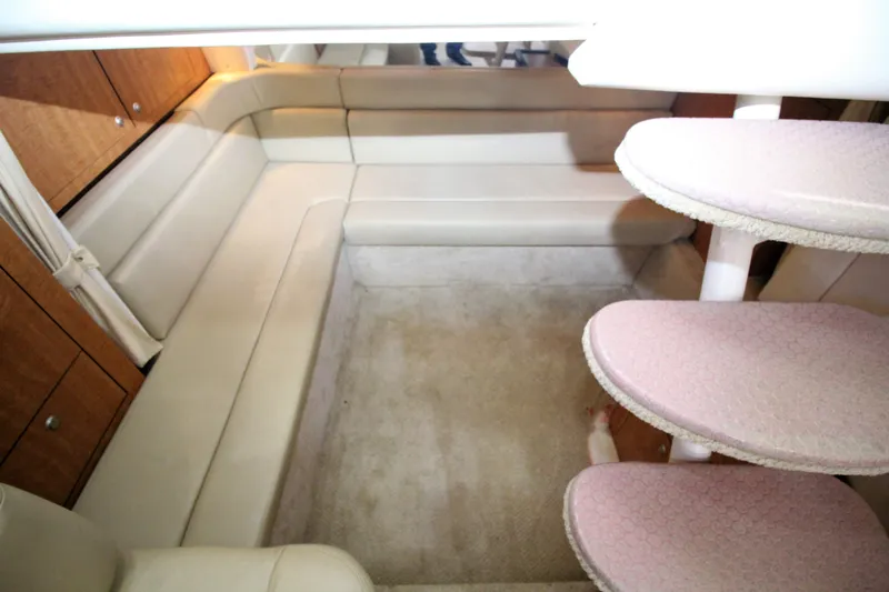  Yacht Photos Pics 2006 Sea Ray 340 Sundancer interior with beige seating and carpeted steps.