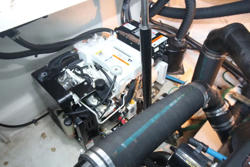  Yacht Photos Pics Engine compartment of 2006 Sea Ray 340 Sundancer with visible components and hoses.