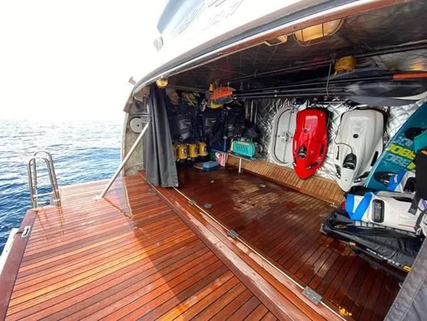 Naughty By Nature Yacht Photos Pics Luxurious 2002 Rizzardi 105 yacht with open storage area and water sports equipment.