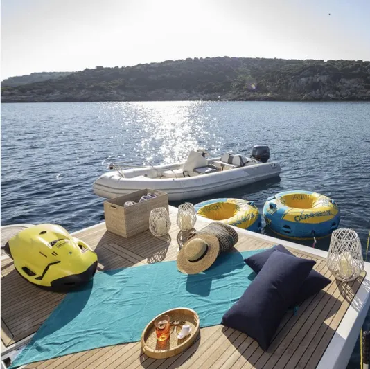 Lidia Yacht Photos Pics Luxurious 2006 Ferretti Yachts 830 deck with water toys, sunbathing setup, and scenic ocean view.