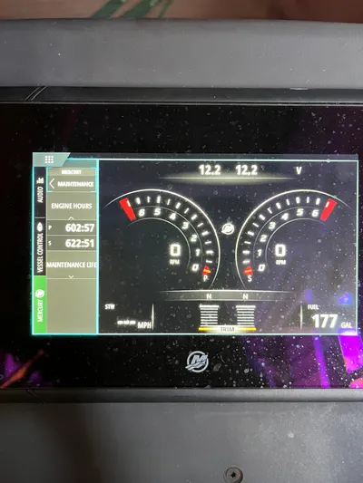  Yacht Photos Pics Digital dashboard of 2019 Axopar 37 Sun Top boat displaying engine hours and fuel level.