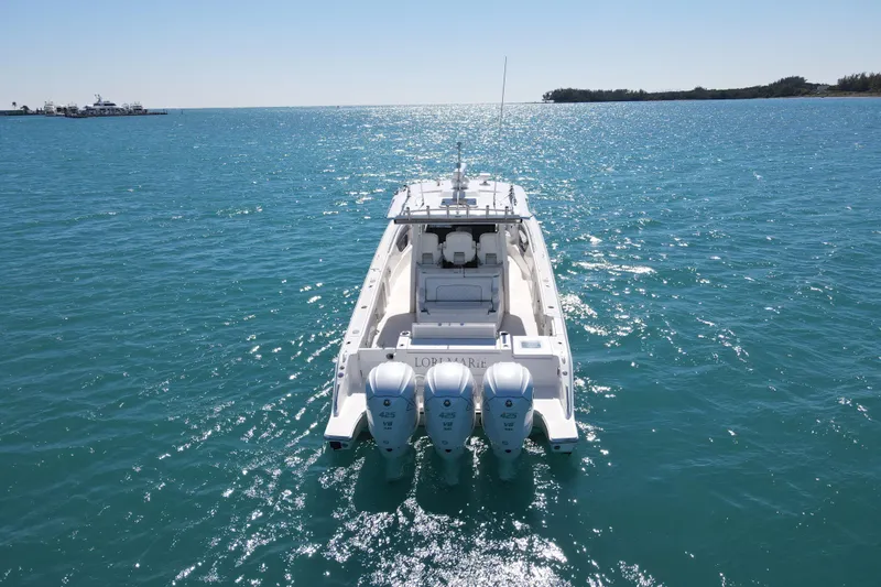  Yacht Photos Pics 2021 Pursuit S 378 Sport boat on open water, rear view with triple engines.