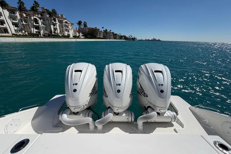  Yacht Photos Pics 2021 Pursuit S 378 Sport boat with triple V8 engines on blue water.