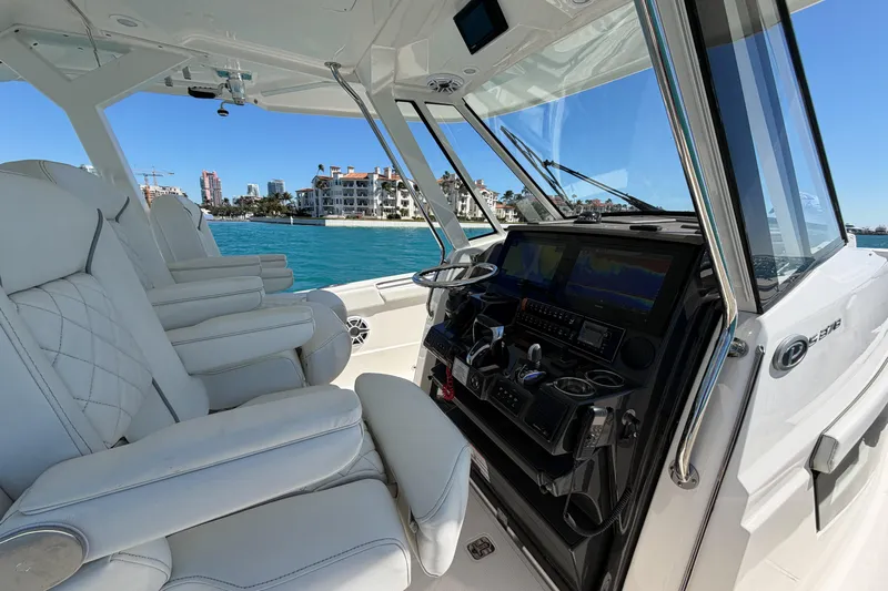  Yacht Photos Pics Interior of 2021 Pursuit S 378 Sport boat with luxurious seating and modern dashboard.