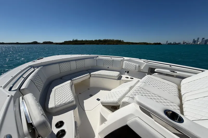  Yacht Photos Pics 2021 Pursuit S 378 Sport boat with luxurious seating on open water.