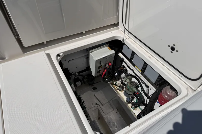  Yacht Photos Pics Open engine compartment of 2021 Pursuit S 378 Sport boat, showing mechanical components.