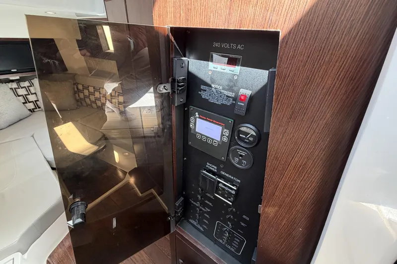  Yacht Photos Pics Electrical panel inside 2021 Pursuit S 378 Sport boat, featuring 240 volts AC controls.