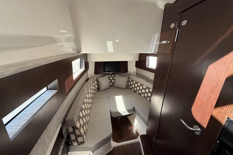  Yacht Photos Pics Luxurious interior of 2021 Pursuit S 378 Sport boat with elegant seating and modern design.