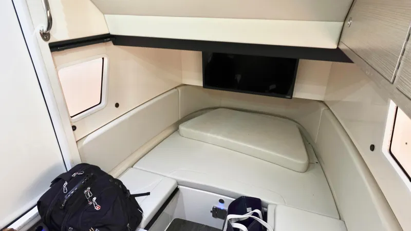  Yacht Photos Pics 2023 Scout 377 LXF cabin interior with seating and storage.