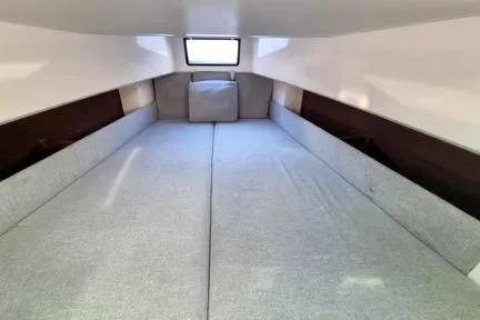  Yacht Photos Pics Interior cabin of 2019 Axopar 37 Sun Top with grey cushions and window.