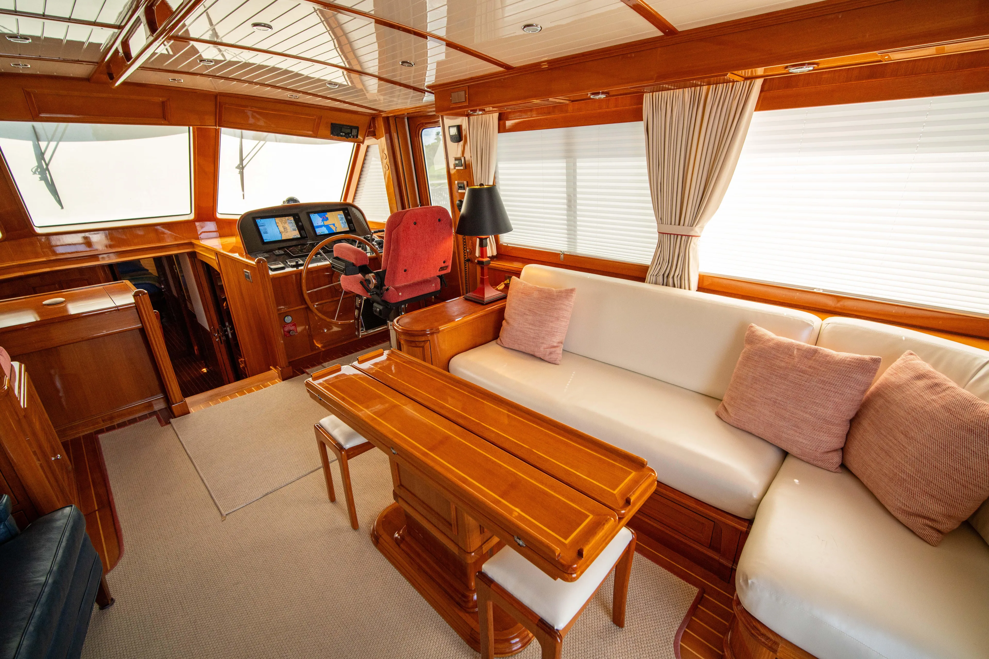Halcyon Yacht Photos Pics Luxurious interior of 2004 Grand Banks 58 Eastbay FB yacht with elegant wood finishes.