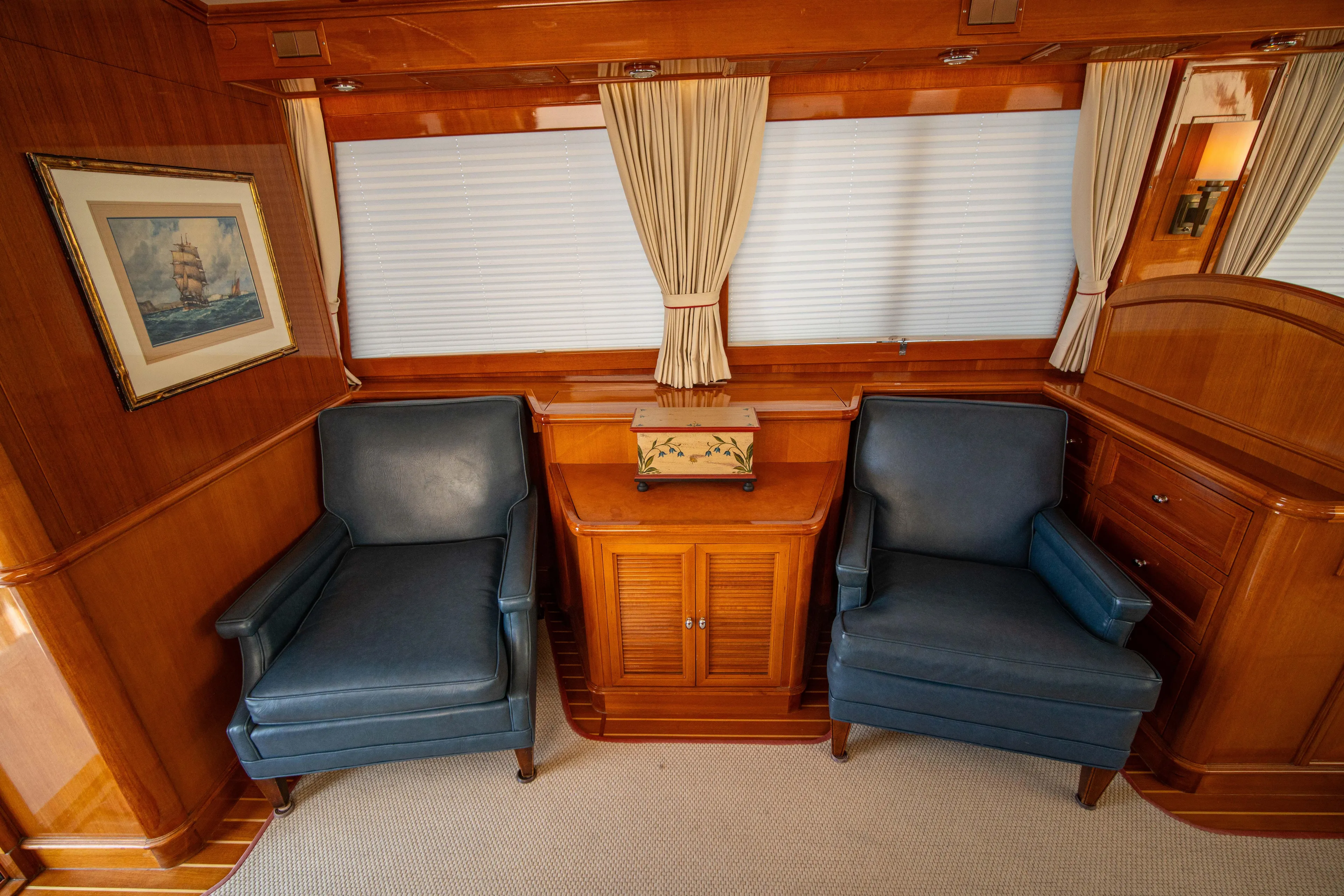 Halcyon Yacht Photos Pics Luxurious 2004 Grand Banks 58 Eastbay FB yacht interior with elegant seating and wood paneling.