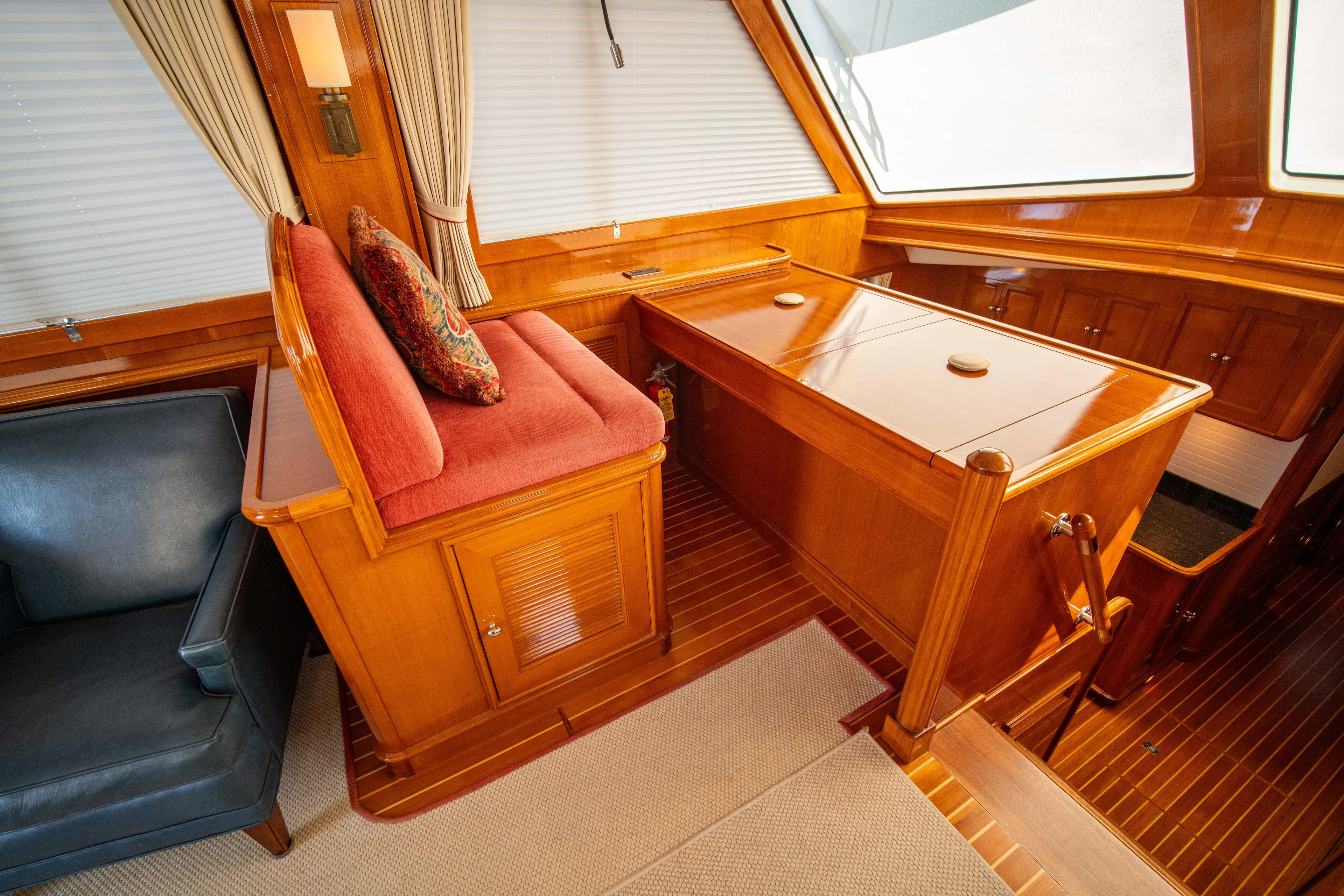 Halcyon Yacht Photos Pics Interior of 2004 Grand Banks 58 Eastbay FB with wood finish and seating area.
