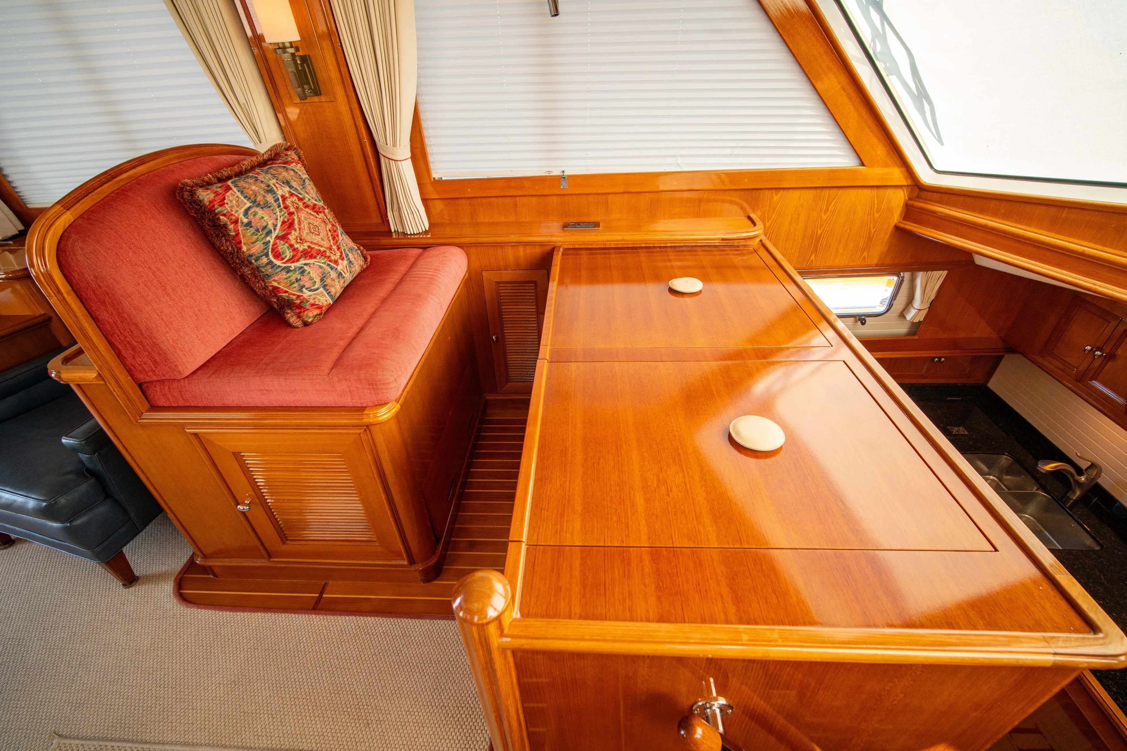 Halcyon Yacht Photos Pics Luxurious wooden interior of 2004 Grand Banks 58 Eastbay FB yacht with elegant seating.