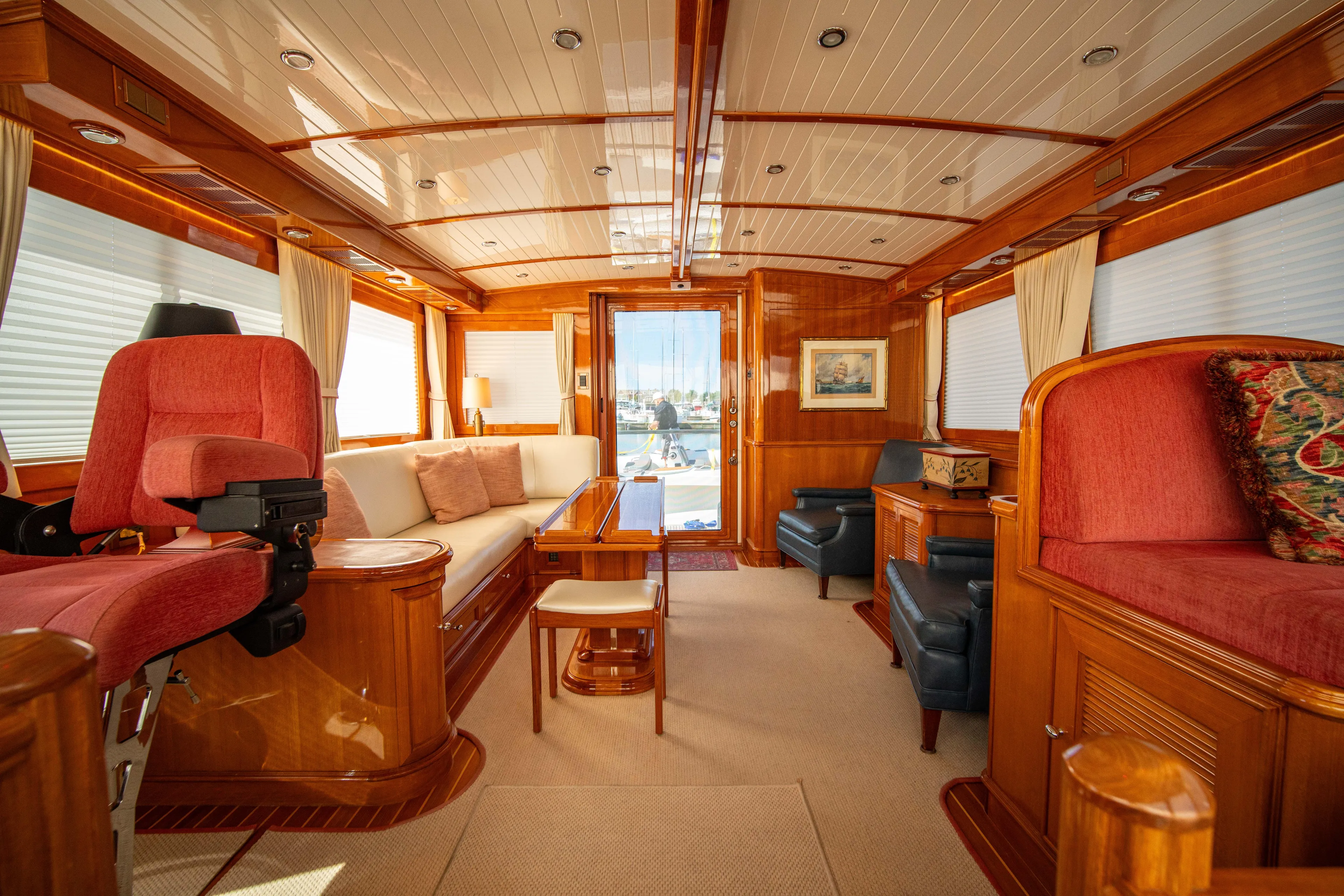 Halcyon Yacht Photos Pics Luxurious interior of 2004 Grand Banks 58 Eastbay FB yacht with elegant wood finishes.