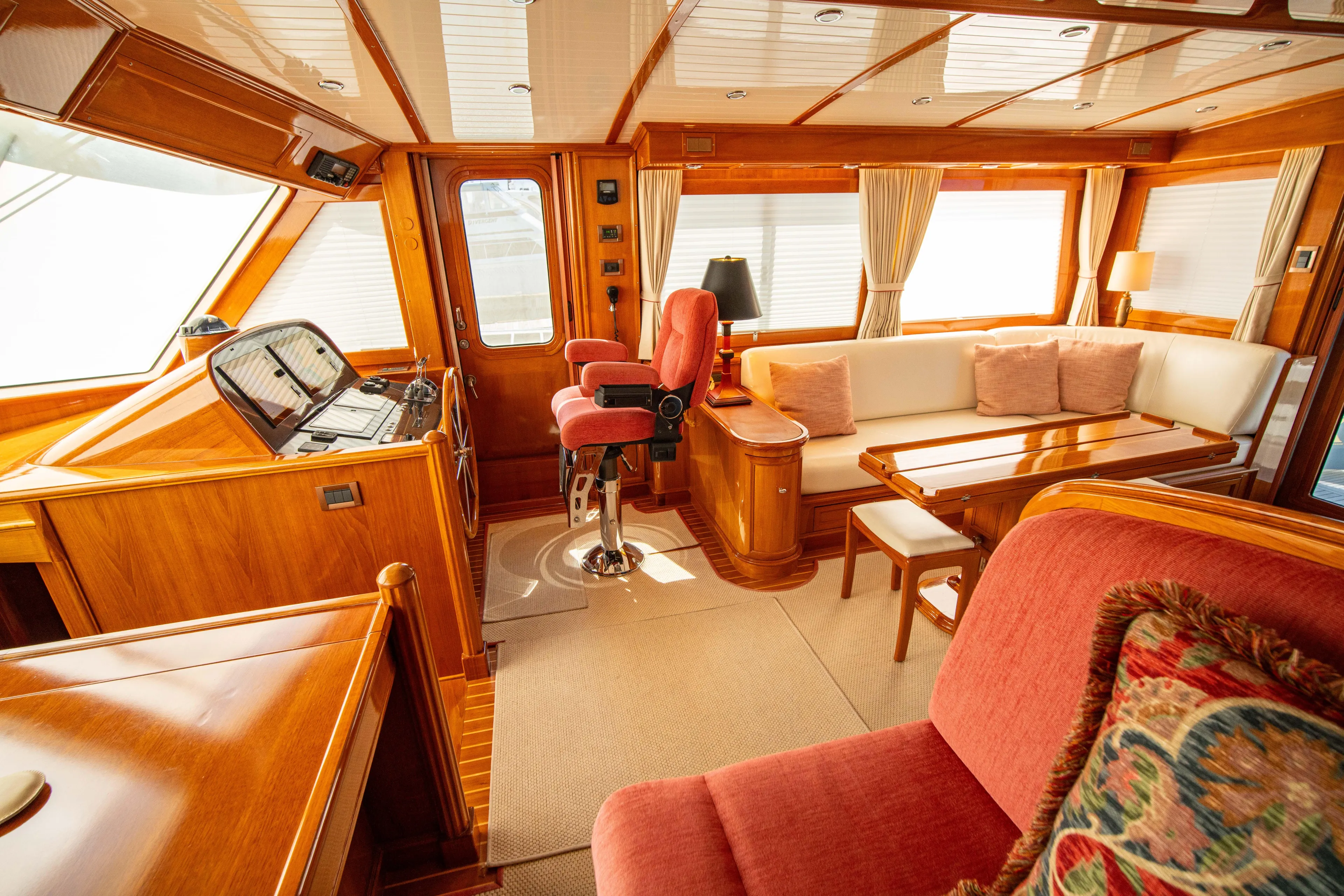 Halcyon Yacht Photos Pics Luxurious interior of 2004 Grand Banks 58 Eastbay FB yacht with elegant wood finish.