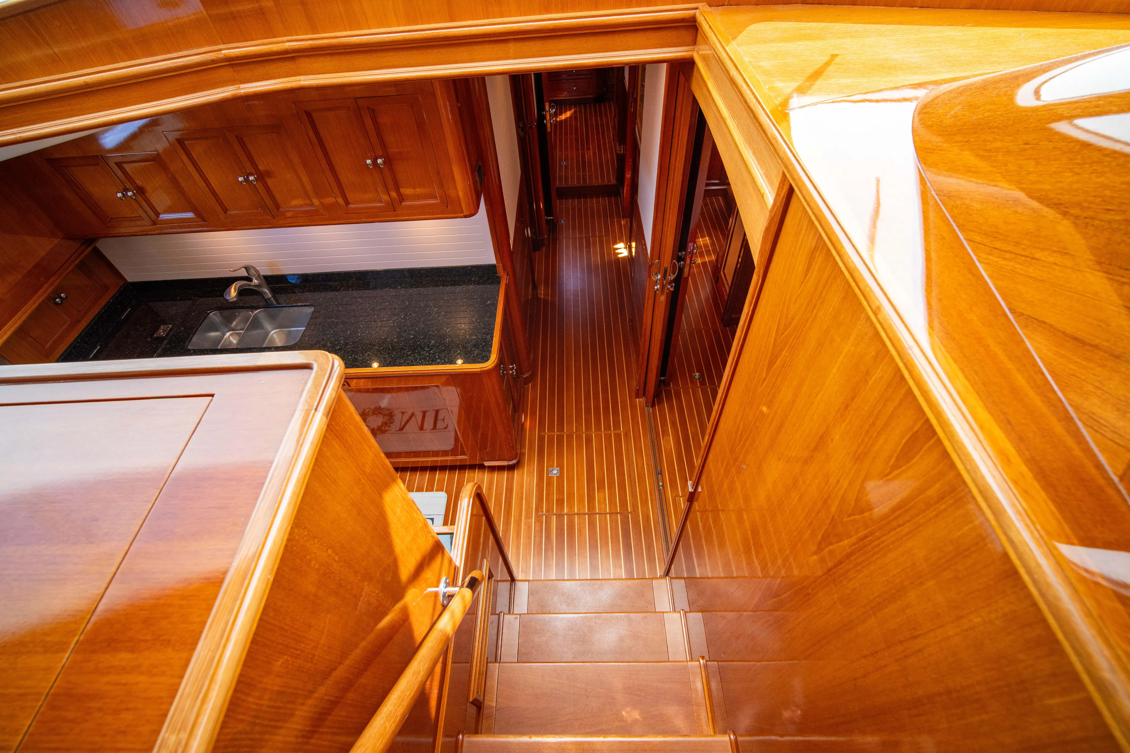 Halcyon Yacht Photos Pics Luxurious wooden interior of 2004 Grand Banks 58 Eastbay FB yacht.