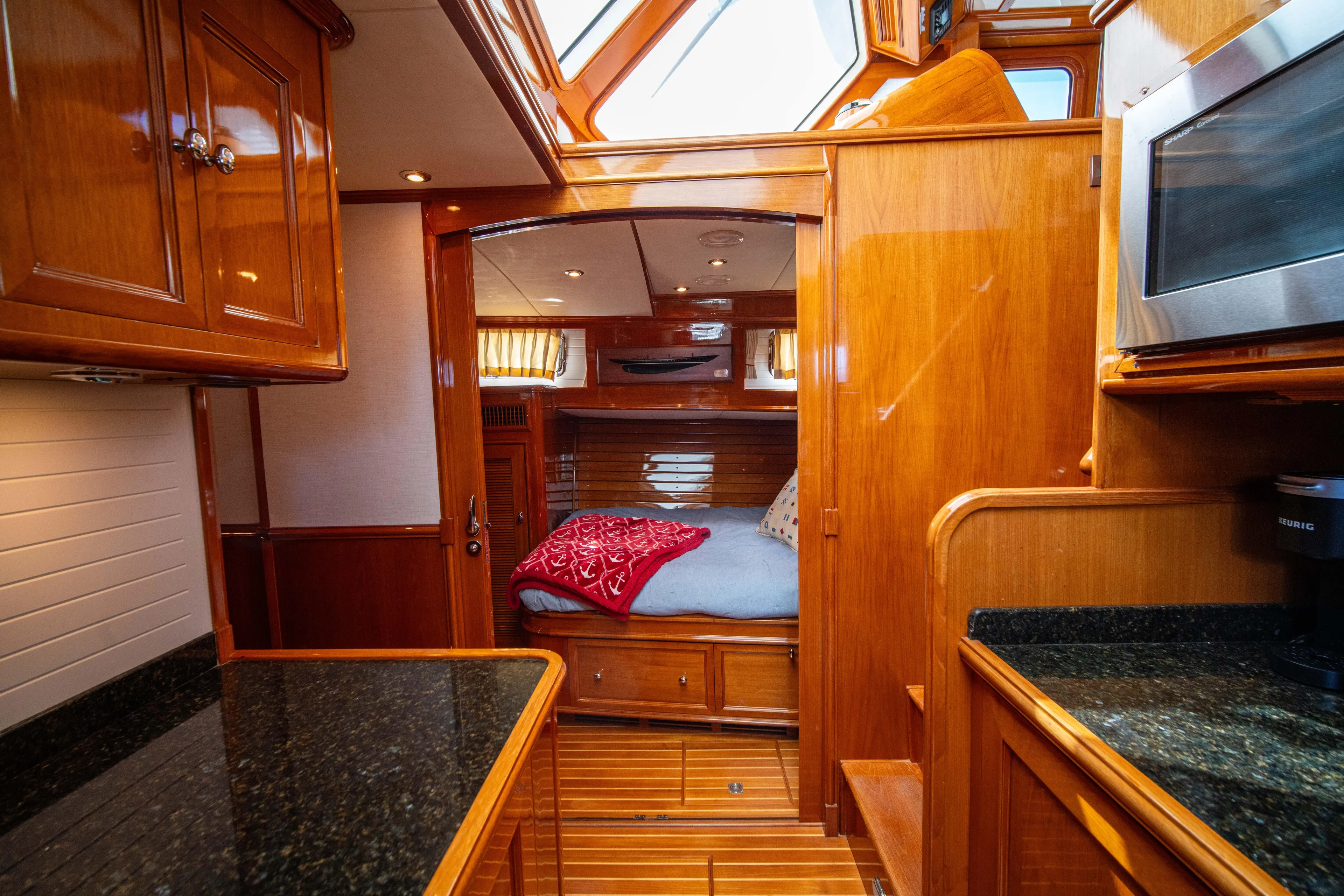Halcyon Yacht Photos Pics Luxurious 2004 Grand Banks 58 Eastbay FB yacht interior with wood finish and cozy cabin.