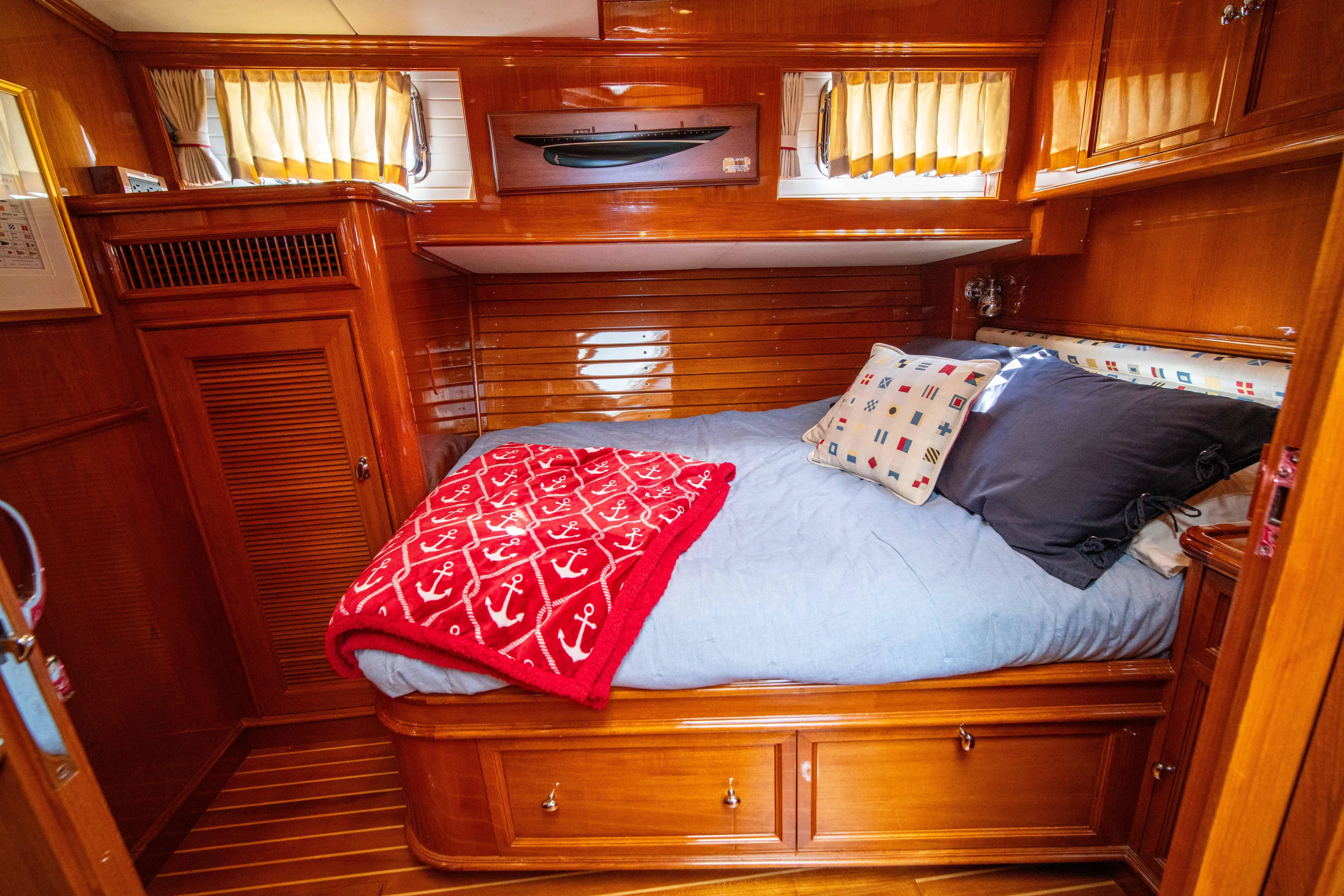 Halcyon Yacht Photos Pics Luxurious wooden cabin interior of 2004 Grand Banks 58 Eastbay FB yacht.