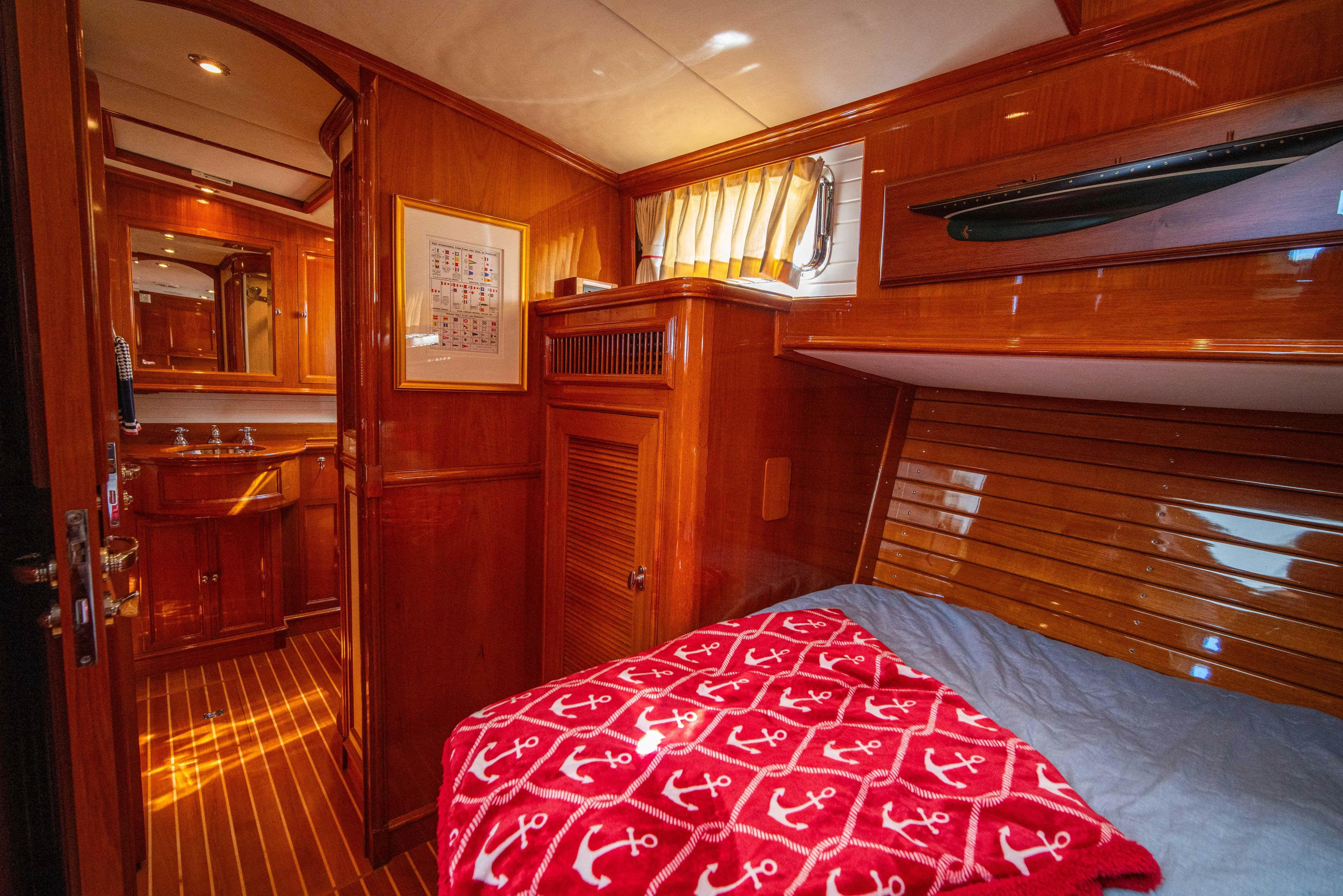 Halcyon Yacht Photos Pics Luxurious cabin interior of 2004 Grand Banks 58 Eastbay FB yacht with wood finish.