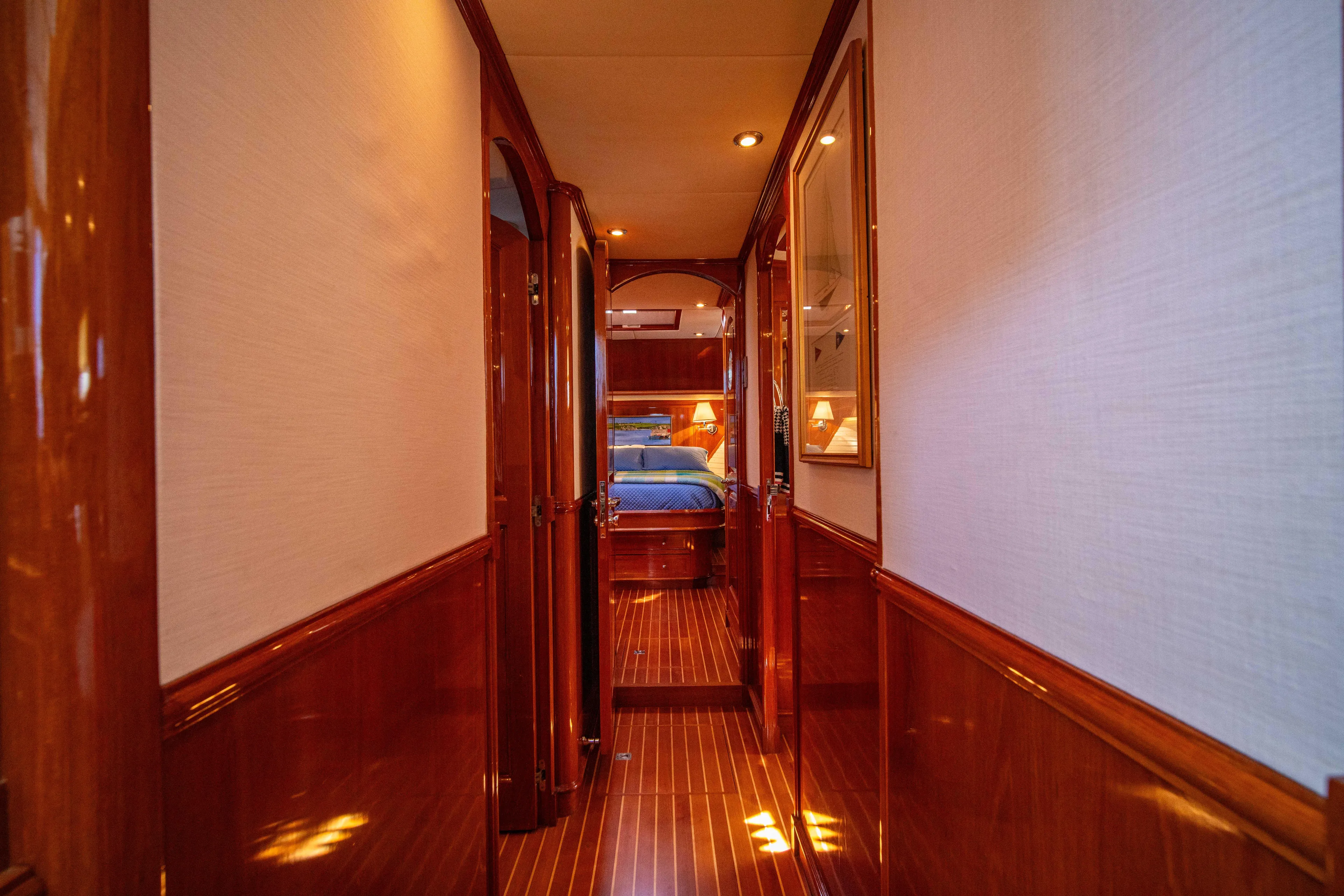 Halcyon Yacht Photos Pics Luxurious wooden interior hallway of 2004 Grand Banks 58 Eastbay FB yacht.