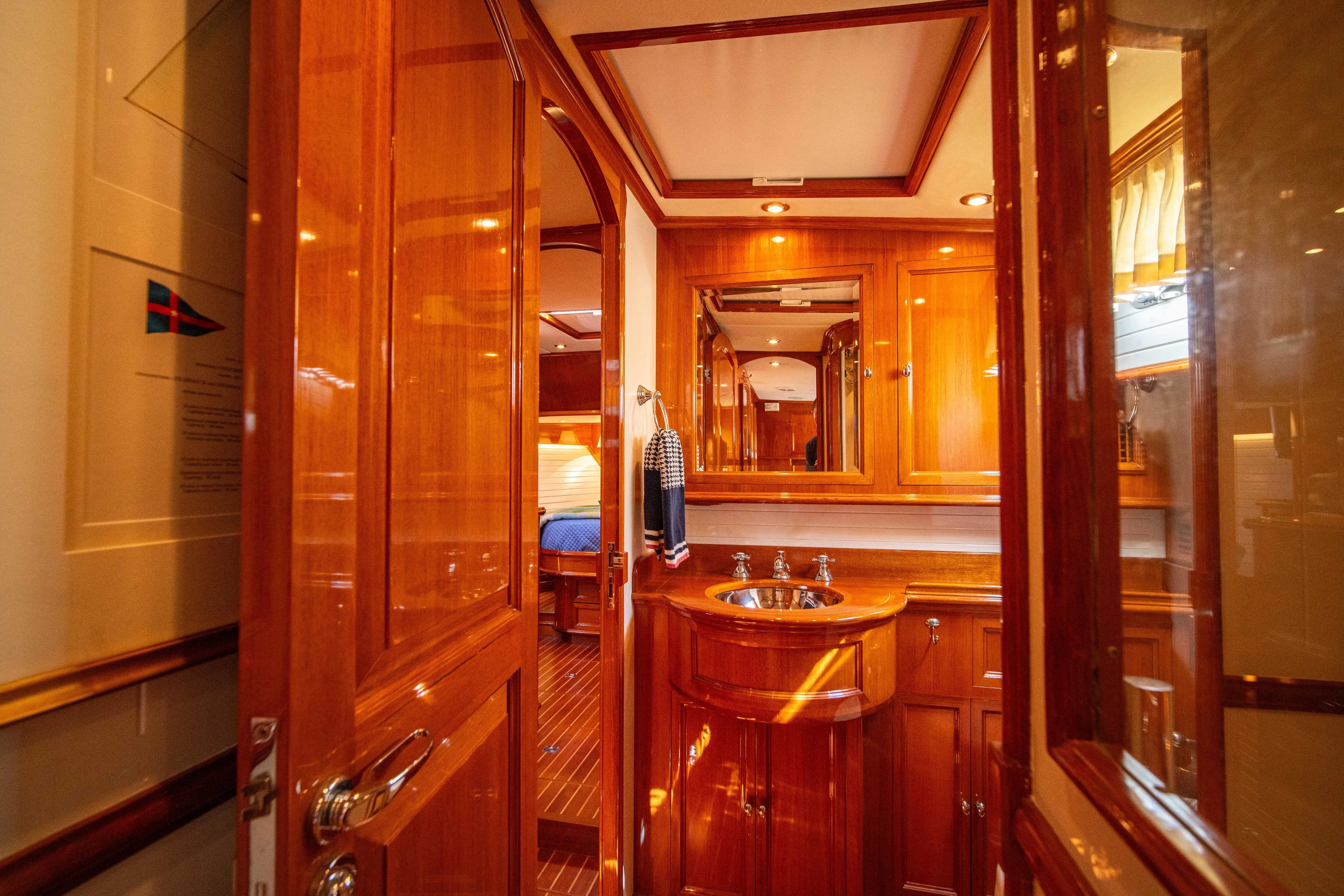 Halcyon Yacht Photos Pics Luxurious wooden interior of 2004 Grand Banks 58 Eastbay FB yacht bathroom.