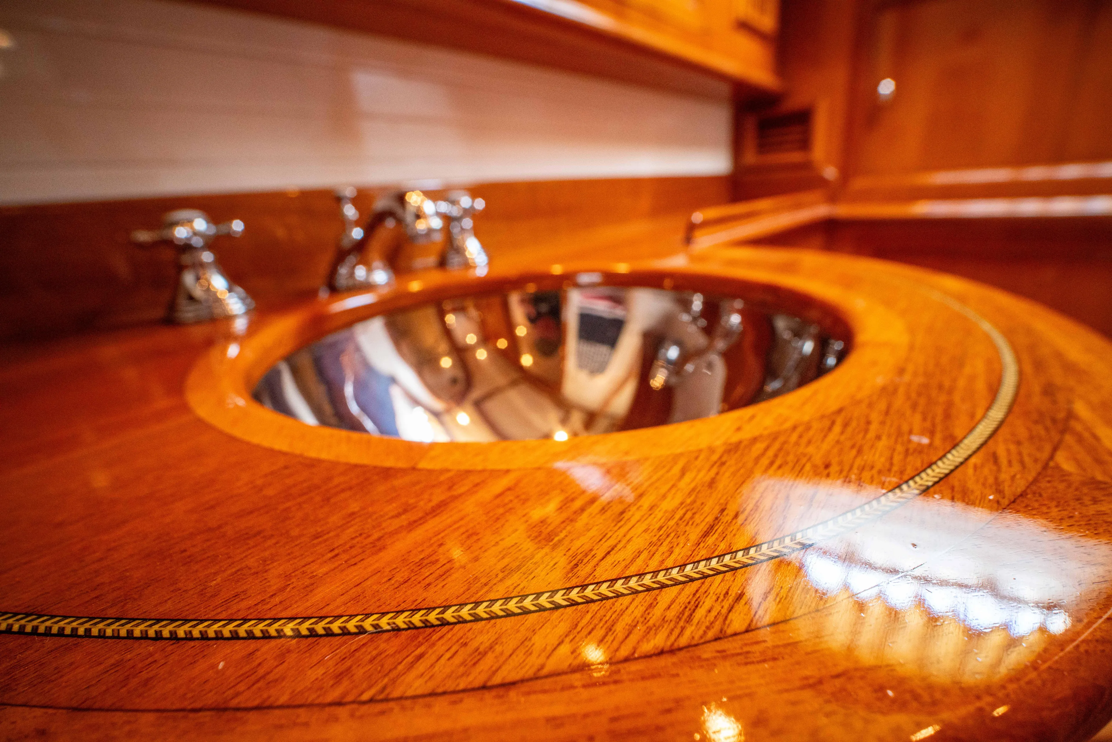 Halcyon Yacht Photos Pics Luxurious wooden sink area on 2004 Grand Banks 58 Eastbay FB yacht.