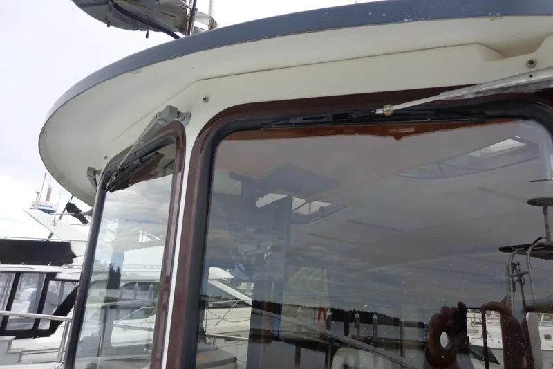 Tugs-n-kisses And Triple Axle Trailer Yacht Photos Pics 2011 Ranger Tugs R-29 Classic boat window detail with trailer.