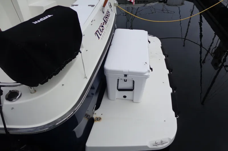 Tugs-n-kisses And Triple Axle Trailer Yacht Photos Pics 2011 Ranger Tugs R-29 Classic boat stern with cooler on swim platform.