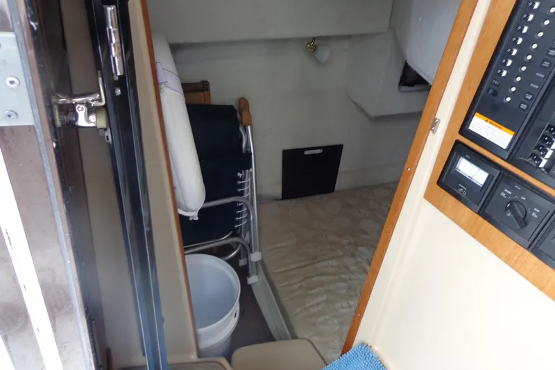 Tugs-n-kisses And Triple Axle Trailer Yacht Photos Pics 2011 Ranger Tugs R-29 Classic cabin interior with control panel and storage.