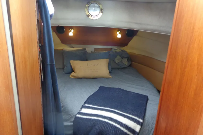 Tugs-n-kisses And Triple Axle Trailer Yacht Photos Pics 2011 Ranger Tugs R-29 Classic cabin interior with cozy bed and nautical decor.