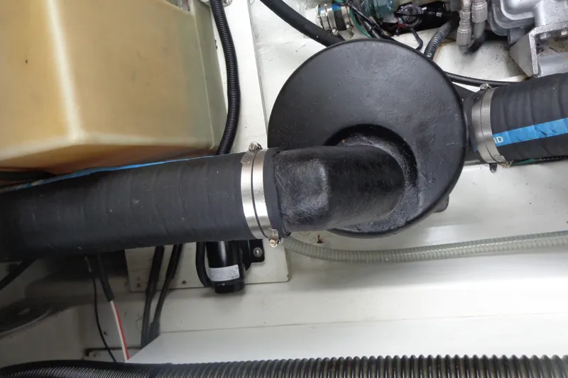 Tugs-n-kisses And Triple Axle Trailer Yacht Photos Pics Engine compartment of 2011 Ranger Tugs R-29 Classic, showing hoses and components.