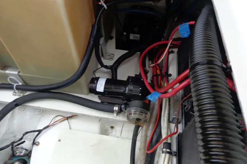 Tugs-n-kisses And Triple Axle Trailer Yacht Photos Pics Engine compartment of 2011 Ranger Tugs R-29 Classic, showcasing wiring and components.