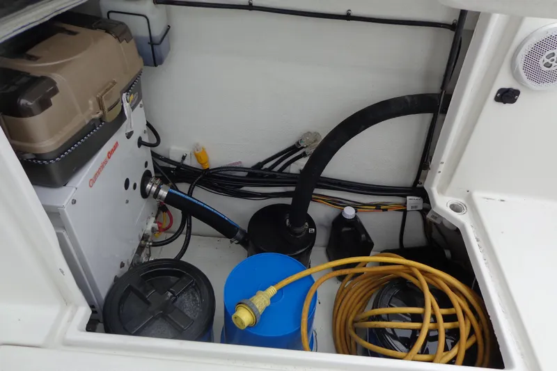 Tugs-n-kisses And Triple Axle Trailer Yacht Photos Pics 2011 Ranger Tugs R-29 Classic engine compartment with generator, cables, and storage.