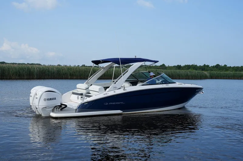  Yacht Photos Pics 2023 Regal 29 OBX boat with Yamaha engine on calm water.