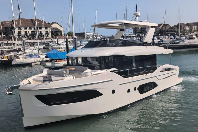 In Stock Yacht Photos Pics 2025 Absolute Navetta 53 yacht docked in a marina, showcasing sleek design and luxury features.