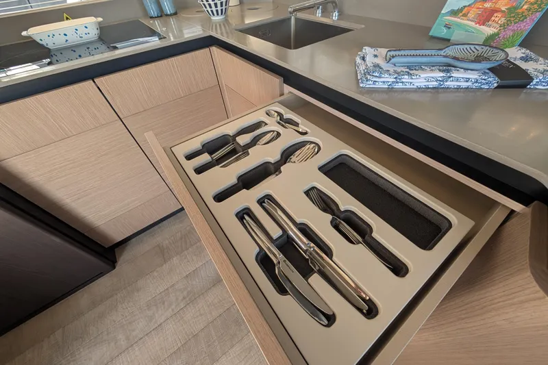 In Stock Yacht Photos Pics Modern kitchen drawer with organized cutlery on Absolute Navetta 53 yacht, 2025 model.