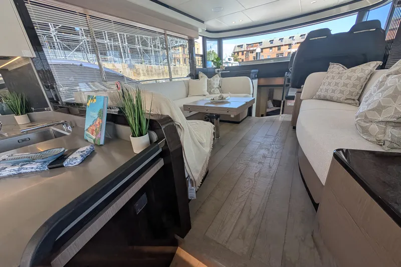 In Stock Yacht Photos Pics Luxurious interior of 2025 Absolute Navetta 53 yacht with elegant seating and decor.