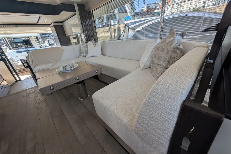 In Stock Yacht Photos Pics Luxurious interior of 2025 Absolute Navetta 53 yacht with elegant seating and decor.