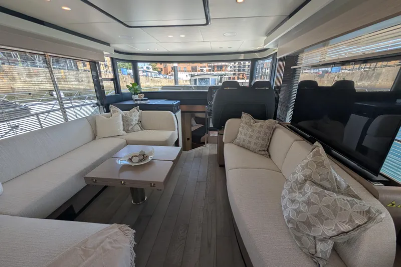 In Stock Yacht Photos Pics Luxurious interior of 2025 Absolute Navetta 53 yacht with elegant seating and modern design.